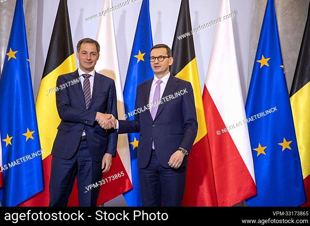 Prime Minister Alexander De Croo and Poland prime Minister Mateusz Morawiecki shake hands at a diplomatic meeting to discuss the Russian invasion of Ukraine...