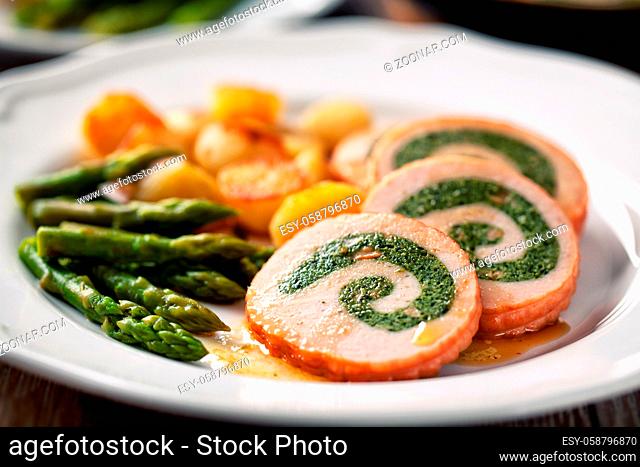Turkey breast stuffed with roasted potatoes and asparagus
