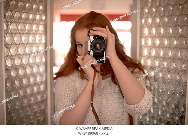 Woman clicking photo with camera