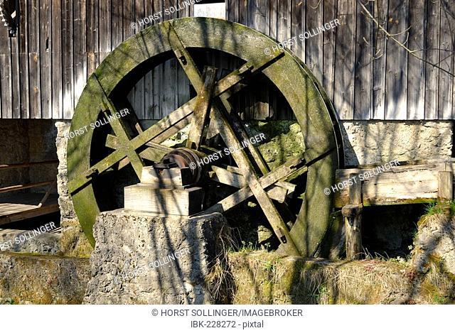 Wooden saw wheel dedicated to operates a historic saw mill displayes on the grounds of the farmhouse museum of Amernag, Germany