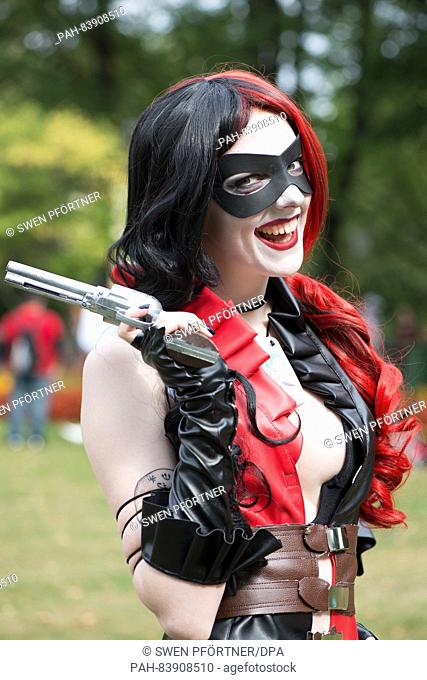 Lena poses with a pistol as 'Harley Quinn' at the manga fair 'Connichi' in Kassel,  Germany, 16 September 2016. Several thousands of visitors in creative...