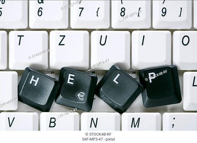 Single word HELP of black keys on computer keyboard