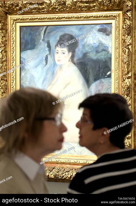 RUSSIA, MOSCOW - APRIL 17, 2023: Visitors look at a painting "" Female Nude"" (1876) by Pierre-Auguste Renoir at an exhibition titled 'After Impressionism' at...