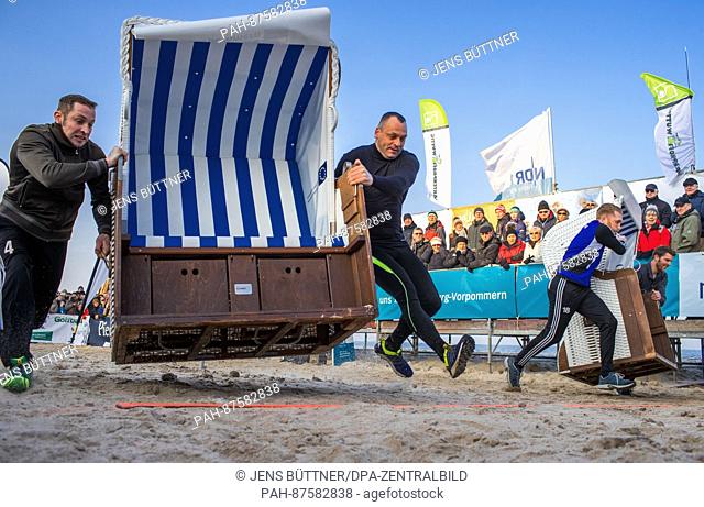 Patrick Lehmann (C) and Robert Ninas (L) during the 20m sprint at the 'Beach Chair Sprint World Cup' in Zinnowitz, Germany, 28 January 2017