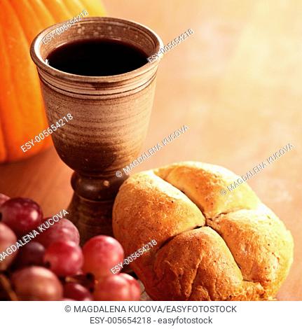 Bread, wine, grapes and pumpkin - thanksgiving or autumn still life