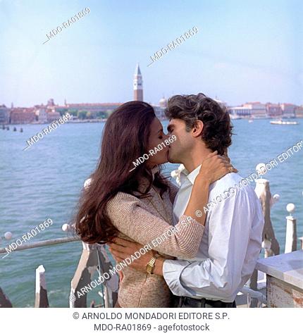 Brazilian actress Florinda Bolkan (Florinda Soares Bulcao) and American actor Tony Musante (Anthony Peter Musante) kissing each other in a scene from the film...