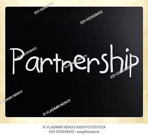 The word 'Partnership' handwritten with white chalk on a blackboard