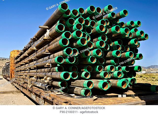 Stacked drill pipe on rail cars in Colorado