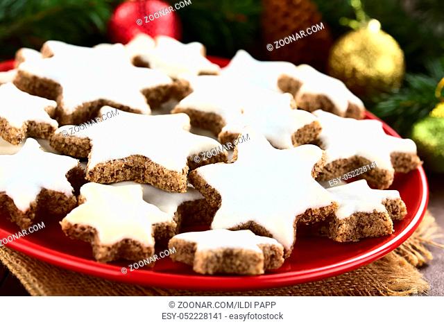 Traditional German Zimtsterne (cinnamon stars) Christmas cookies made of ground almonds, cinnamon, egg white and confectioner's sugar