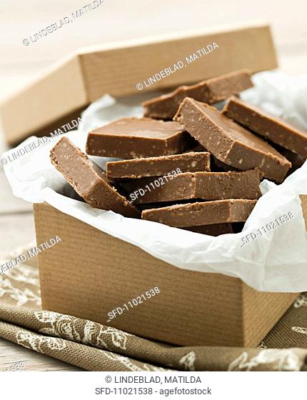 Pieces of peanut nougat in a cardboard box