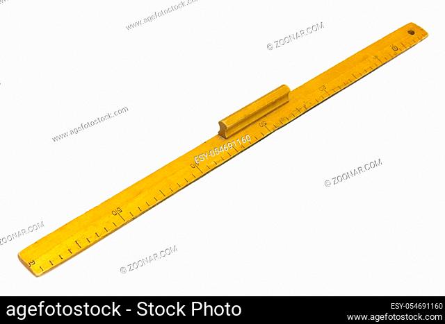 Yellow wooden measuring ruler on a white background