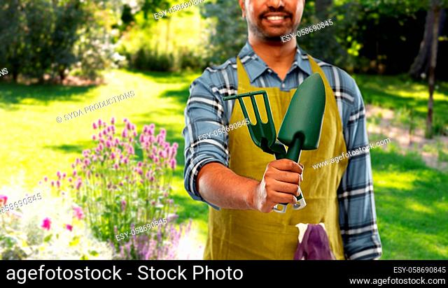 indian gardener or farmer with garden tools