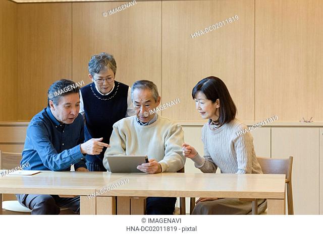 Senior people excited with tablet