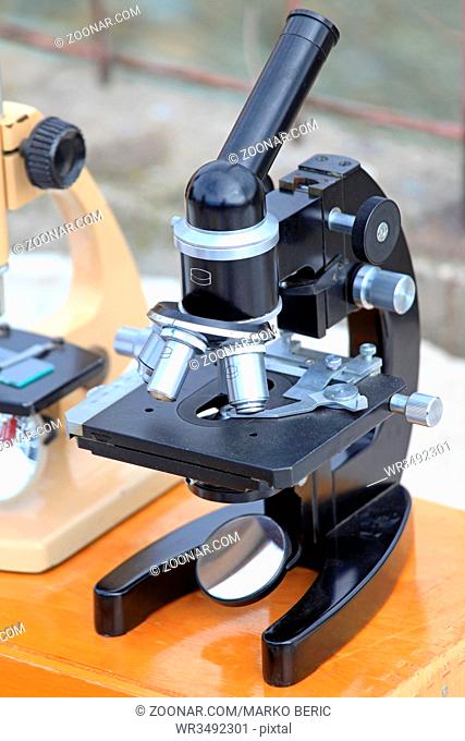 Old Black Optical Microscope Instrument