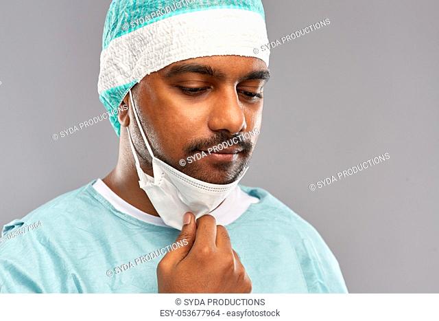 face of sad doctor or surgeon with protective mask