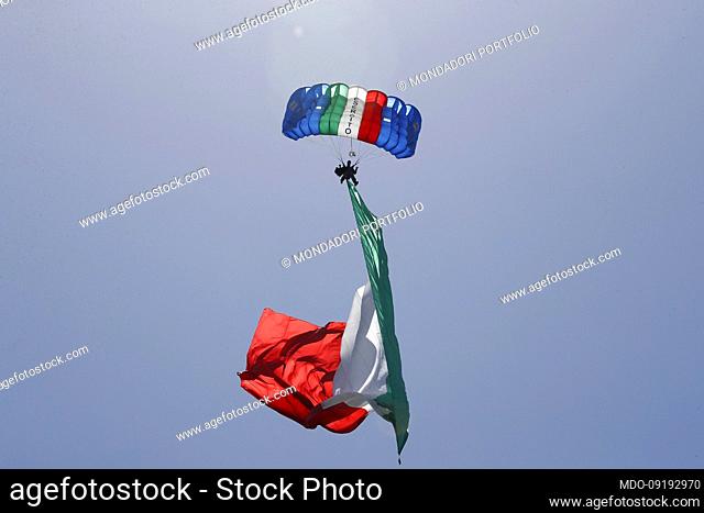 A paratrooper of the Army lands on Via dei Fori Imperiali with a tricolour flag during the celebrations for the Republic Day
