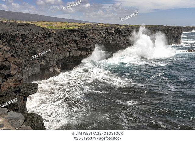 Hawaii Volcanoes National Park, Hawaii - Waves crash against cliffs lining the Pacific coast at the end of the Chain of Craters Road