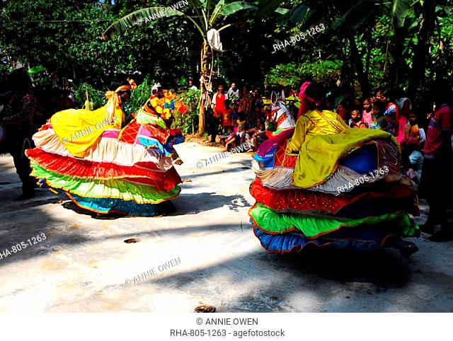 Group of Chaiti Ghoda (Dummy Horse) dancers performing traditional dance at rural village event, Odisha, India, Asia