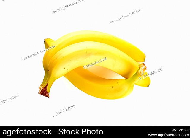 Three tasty yellow bananas isolated on white background
