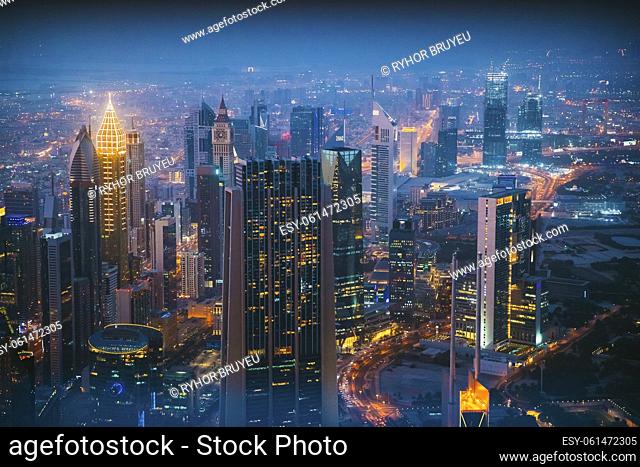 Aerial View Of Evening Night Traffic Of Residential District. Street Night Illumination Of Residential District In Dubai
