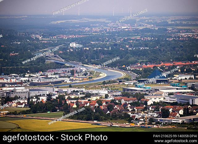 18 June 2021, Bavaria, Nuremberg: Panoramic view from the telecommunications tower in west direction to Fürth to the southwest tangent along the...
