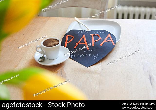 ILLUSTRATION - 11 May 2021, Berlin: ""Dad - Happy Father's Day"" is written on a homemade card that sits on the breakfast plate