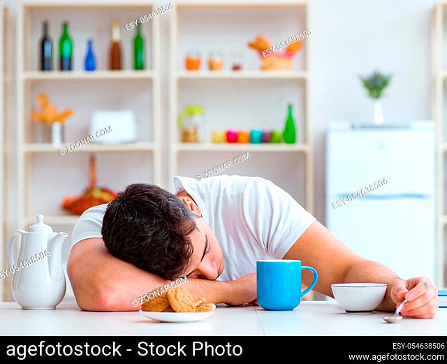 The man falling asleep during his breakfast after overtime work