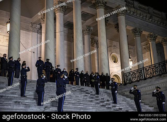 WASHINGTON, DC - FEBRUARY 02: The family of U.S. Capitol Police officer Brian Sicknick watch as his remains are carried up the steps of the U.S