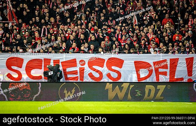 20 December 2023, Berlin: Soccer: Bundesliga, 1. FC Union Berlin - 1. FC Köln, Matchday 16, An der Alten Försterei. A banner of the Union fans on the forest...