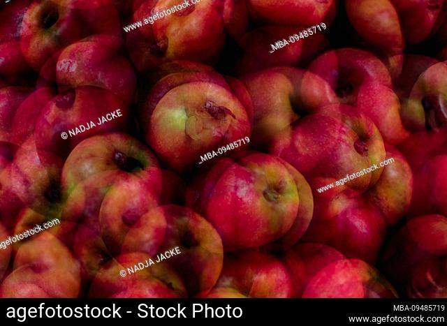 Apples on pile for sale, close-up, alienated
