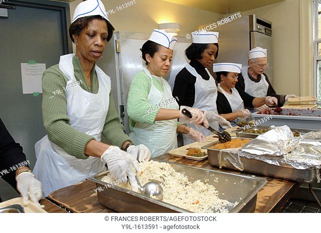 Thanksgiving Dinner is served to the neediest at the Holy Apostles Soup Kitchen in the NYC neighborhood of Chelsea