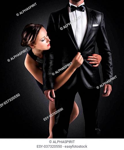 Adoration of businessman by a sexy woman
