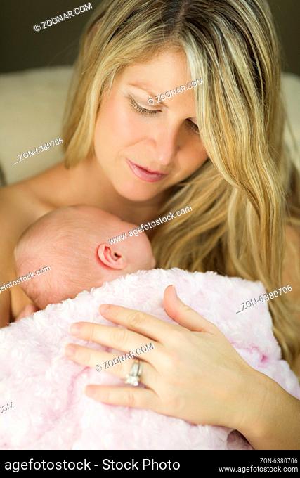 Young Caucasian Beautiful Mother Holding Her Precious Newborn Baby Girl