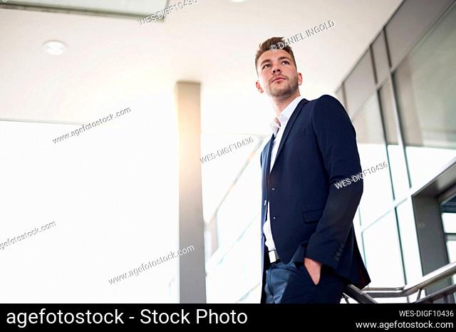 Portrait of a young businessman in the city