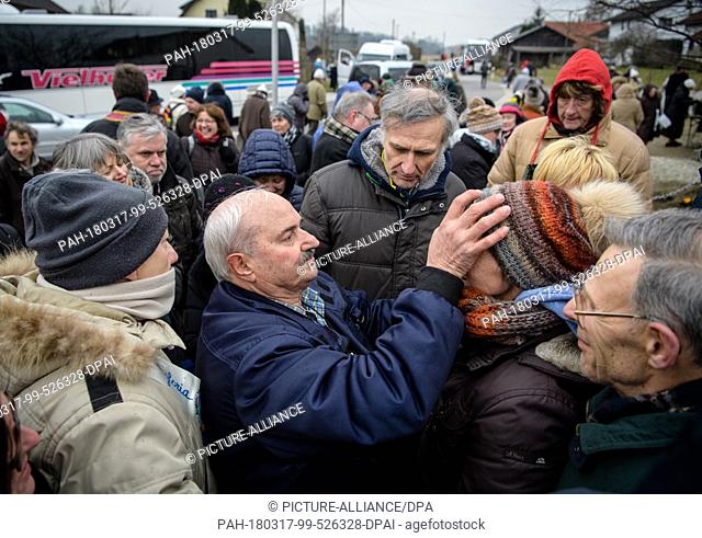 17 March 2018, Germany, Unterflossing: Self-appointed seer, Salvatore Caputa, blessing his followers after the apparent apperance of the Virgin Mary at the St