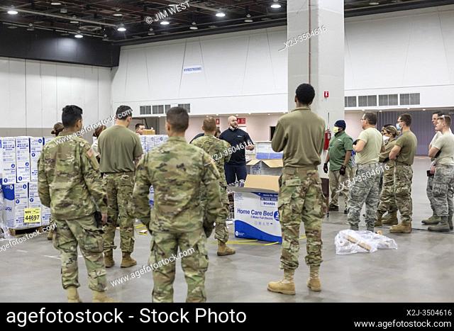 Detroit, Michigan USA - 2 April 2020 - Workers construct an emergency field hospital at the TCF convention center. The 1