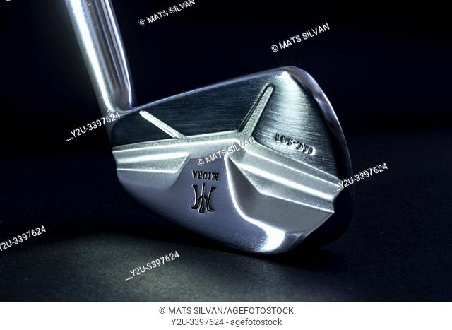 Golf Club Iron Miura MC 501 Illuminated on Black Background
