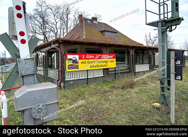 19 December 2023, Brandenburg, Vetschau/Ot Raddusch: A poster from the Raddusch stopping point citizens' initiative hangs on the former station building in...