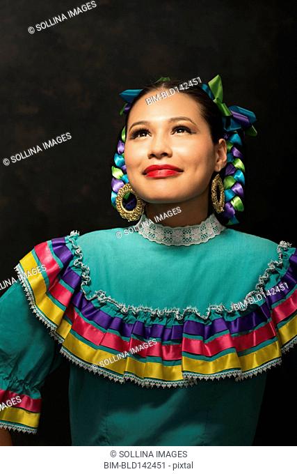 Hispanic teenage girl wearing Puebla Folkloric dress