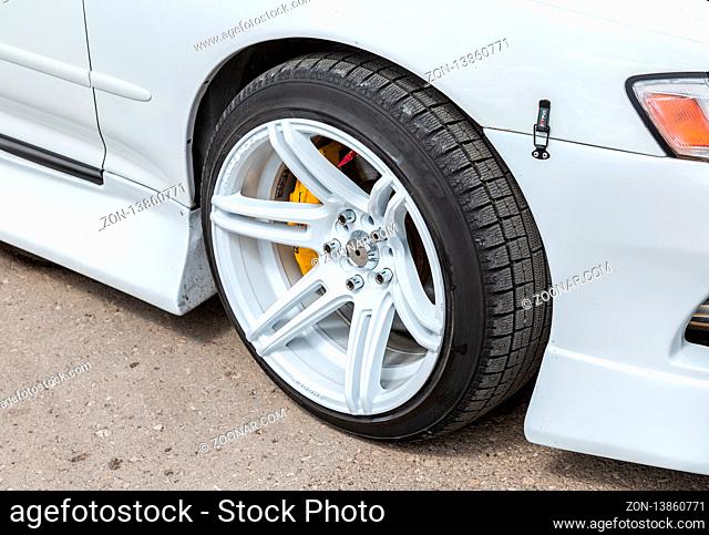 Samara, Russia - May 18, 2019: Modern automotive wheel on light alloy disc with low profile tire