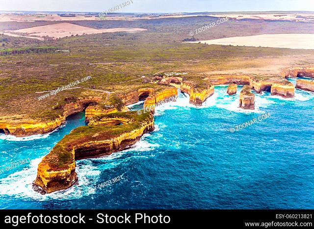 Scenic coastline. Picture taken from a helicopter. Australia, Port Campbell Park. Great Ocean Road and the Twelve Apostles is a group of limestone cliffs