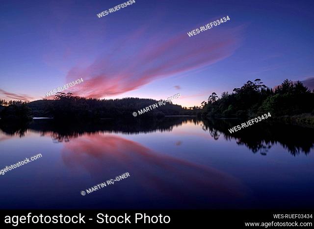 Long exposure of Lake Mangamahoe at purple dawn