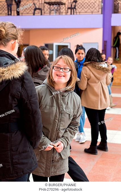 Teenage girl with Down syndrome 13 year old educated in ULIS (Localised Units for Inclusion School). Charente, France