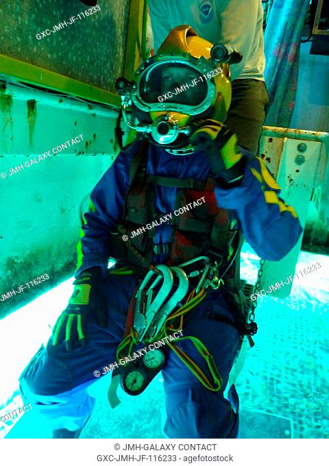 NEEMO 14 crew member Andrew Abercromby prepares for an undersea session of extravehicular activity (EVA) for the 14th NASA Extreme Environment Mission...