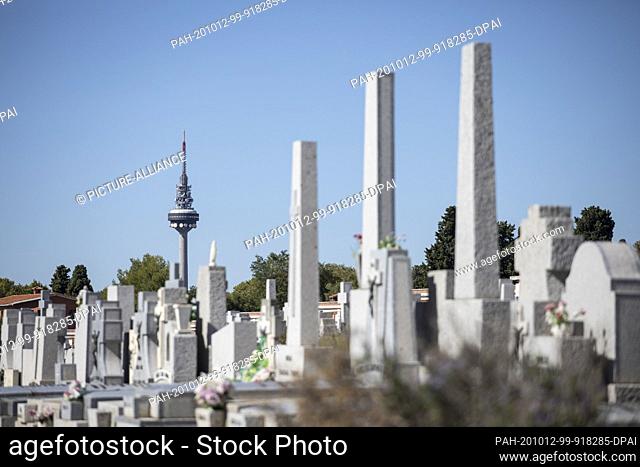 12 October 2020, Spain, Madrid: View from the Almudena cemetery to the antennas of the broadcasting company RTVE on the television tower on the Spanish national...