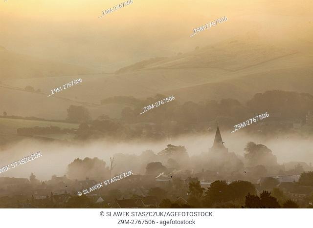 Misty autumn sunrise in Alfriston, South Downs National Park, East Sussex, England