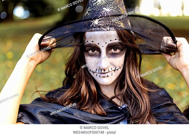 Portrait of masquerade girl at Halloween