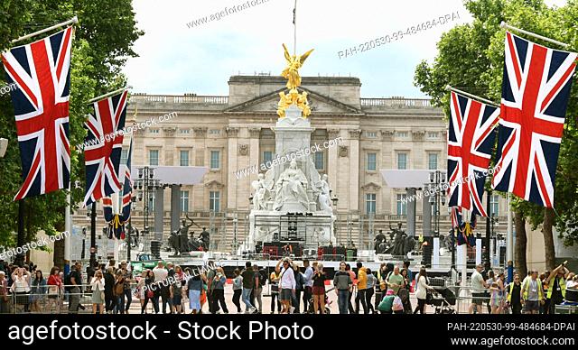 28 May 2022, Great Britain, London: Many flags line the wide boulevard, Regent Street, leading to Buckingham Palace (M). For the Queen's Platinum Jubilee