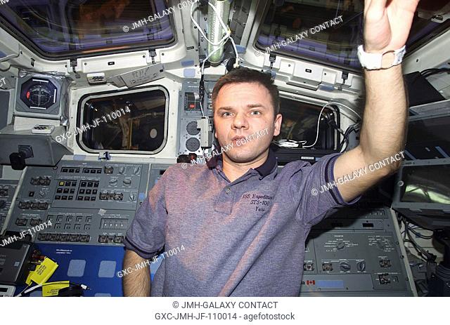 Cosmonaut Yuri P. Gidzenko, now a member of the STS-102 crew, on Discovery's flight deck. Gidzenko, representing Rosaviakosmos