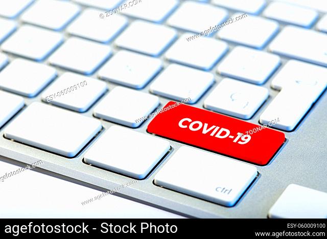 Coronavirus concept. Keyboard with red key and COVID-19 message
